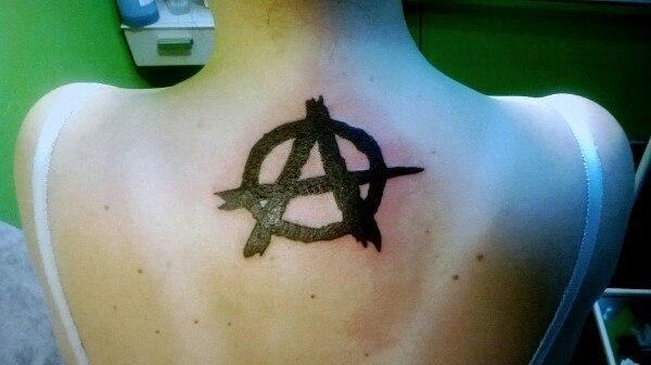 Anarchy tattoo on trapeze