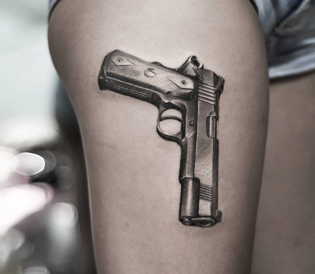 Что означает тату пистолет?