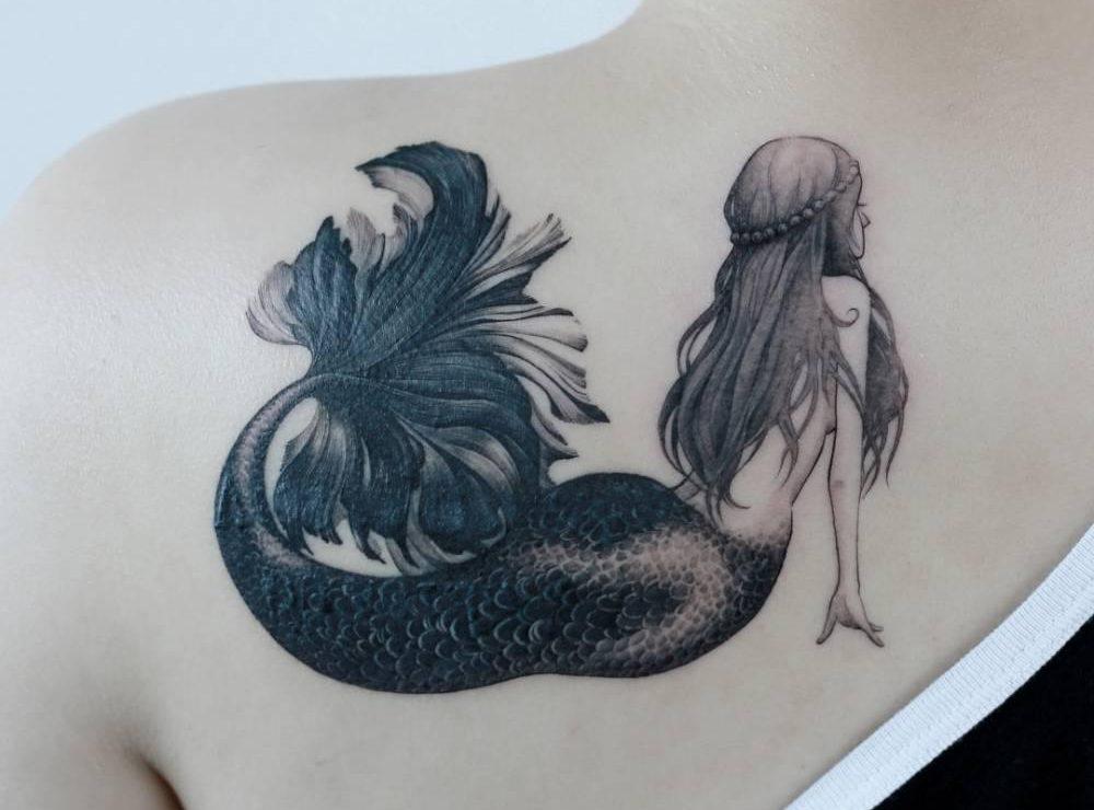 Mermaid tattoo on the mil blade