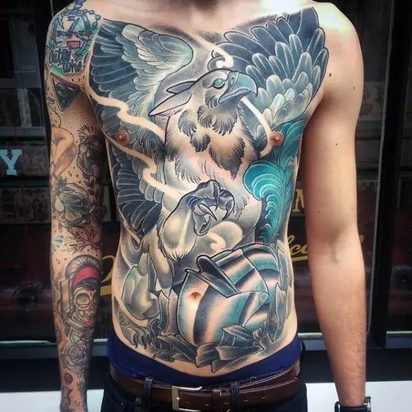 Large griffin tattoo on stomach