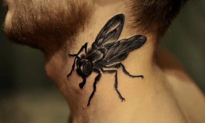 Fly tattoo on man's neck