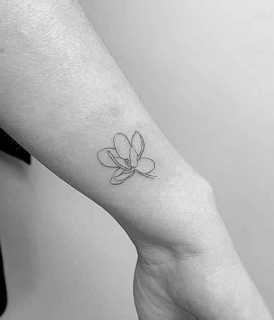 Magnolia Tattoo On Hand.