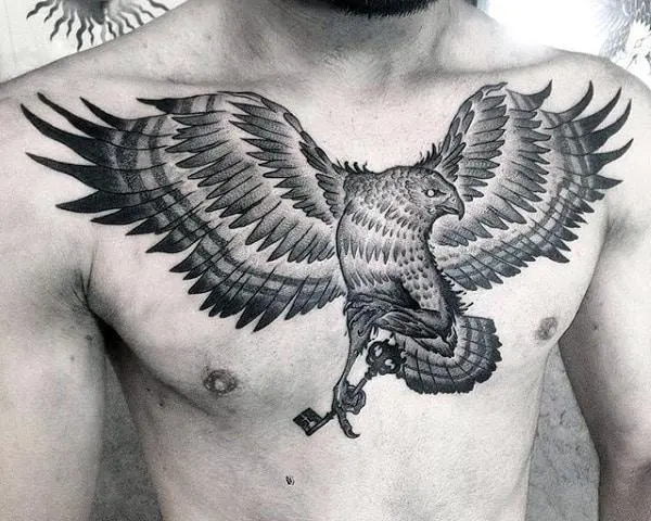 Falcon Tattoo With Key On Guy Chest