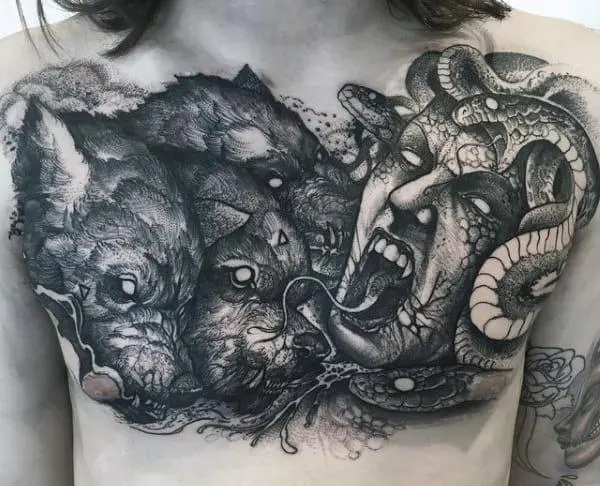 Cerberus tattoo on the chest of a man