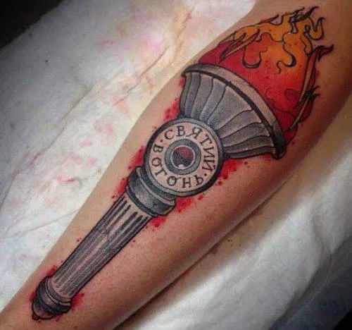 Sacred fire tattoo on leg