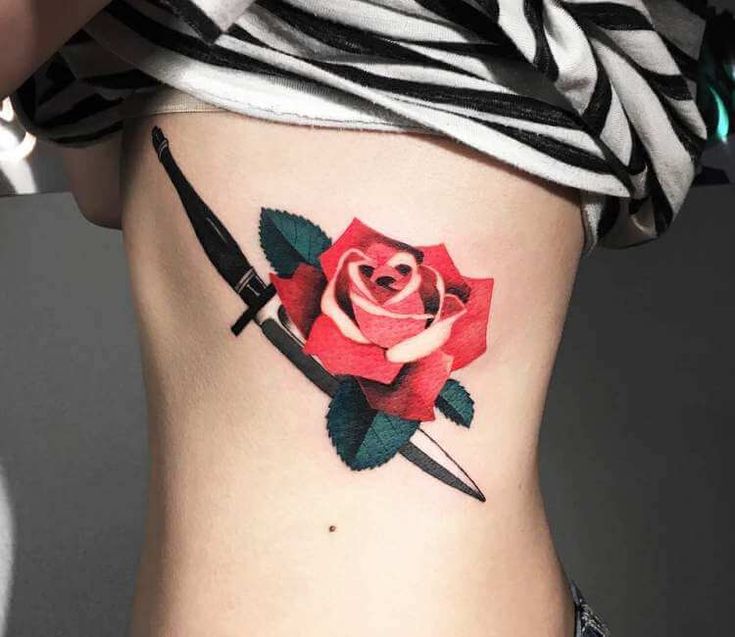 Что означает тату роза с кинжалом?