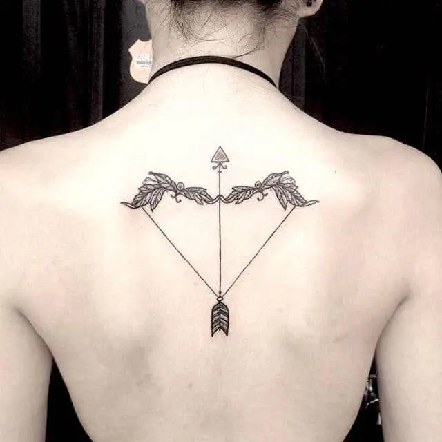 Bow And Arrow Tattoo On Girl Back