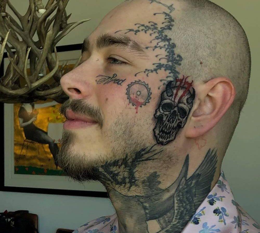 Tattoos on the cheek of the guy