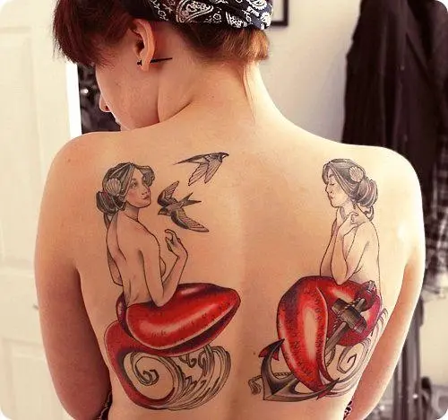 Two mermaids on a female back