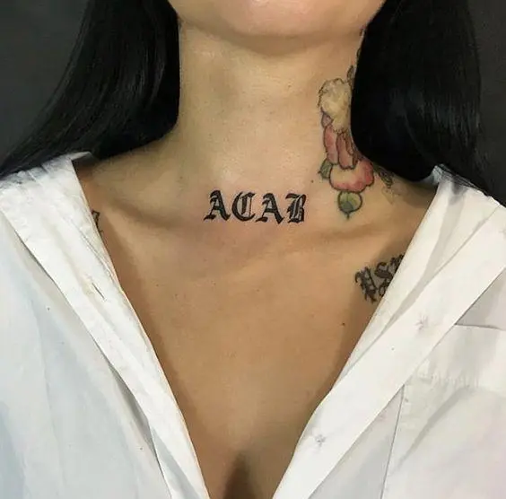 Acab tattoo on female body