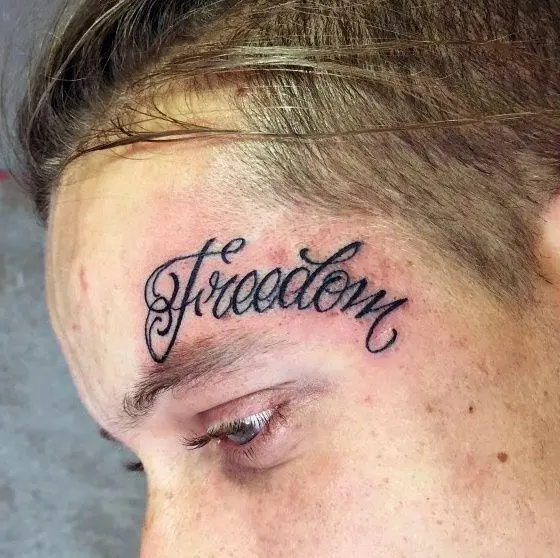 Freedom Tattoo On Guy Face