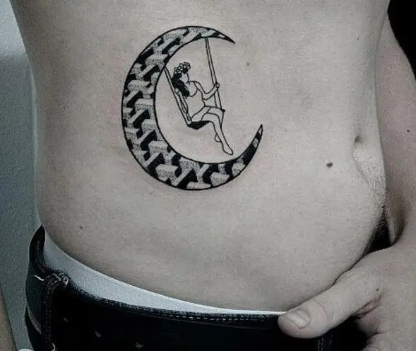 Crescent moon tattoo on stomach