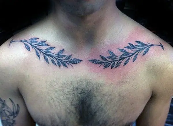 Olive twigs tattoo on male chest