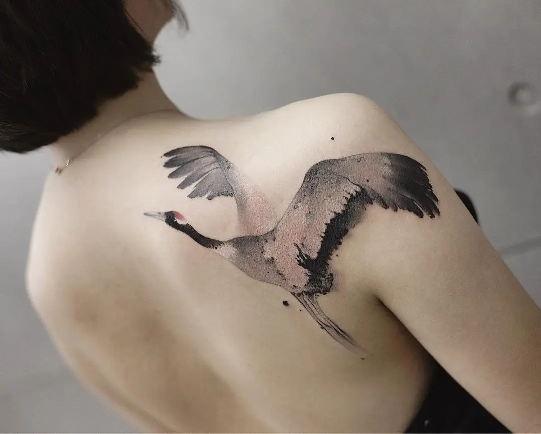 fliegender Kranich Tattoo