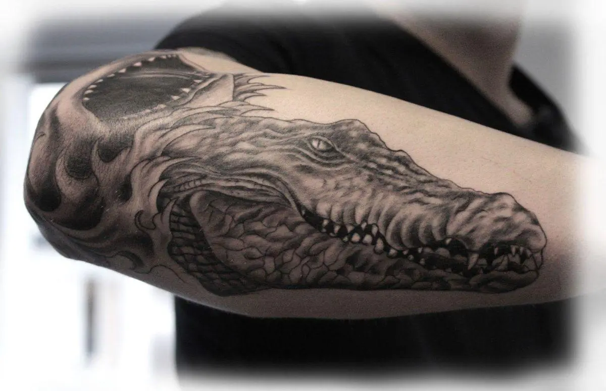 crocodile tattoo on forearm