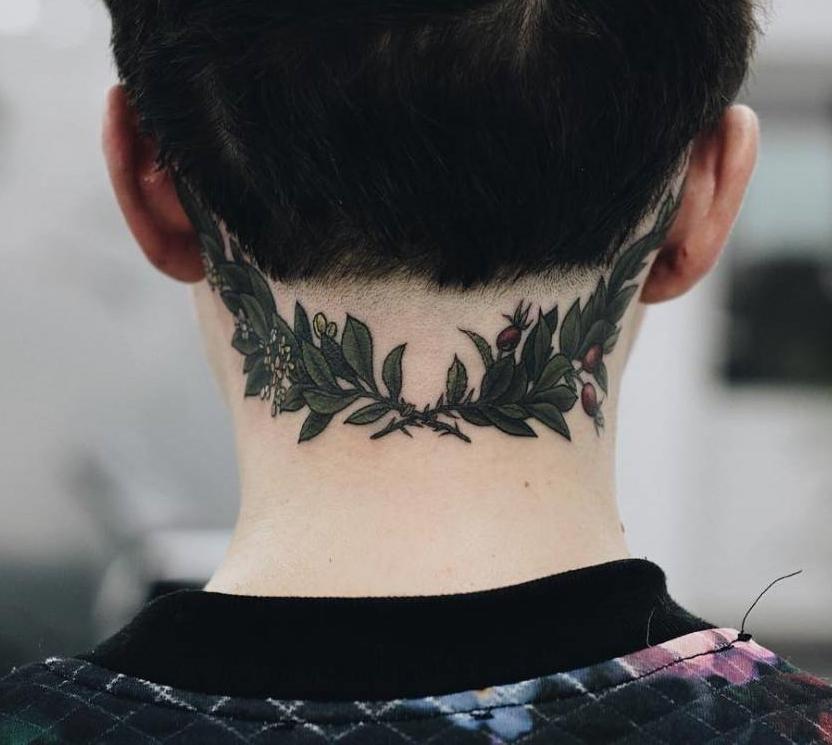 Photo of laurel wreath tattoo on head.