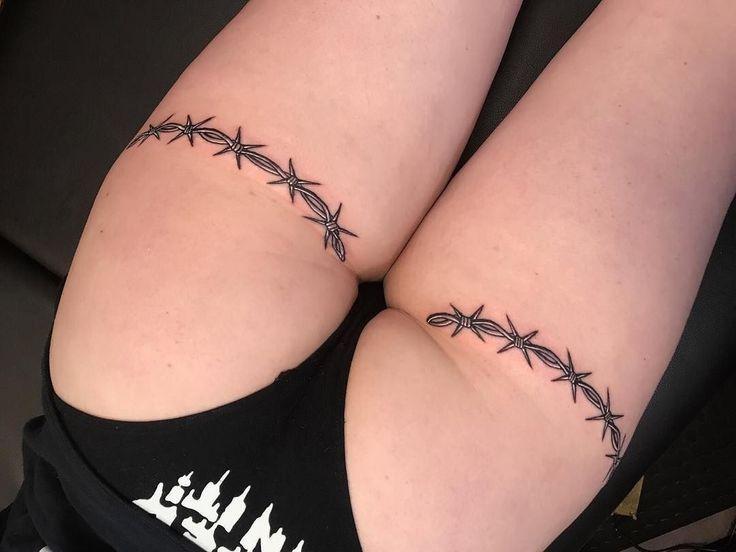Photo of barbed wire tattoo on leg.