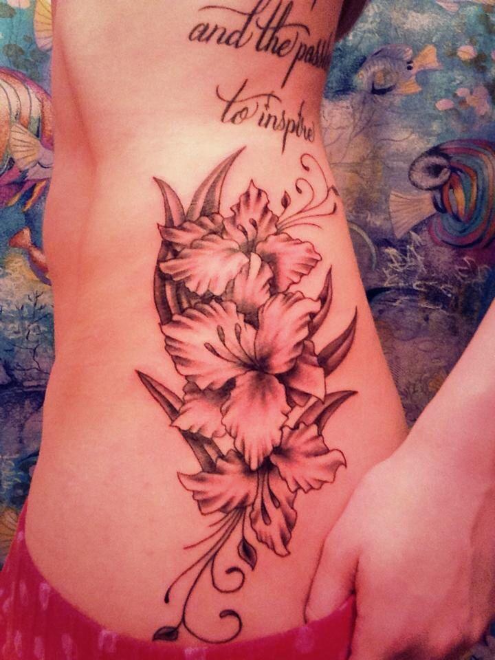 Photo of gladiolus tattoo on body.