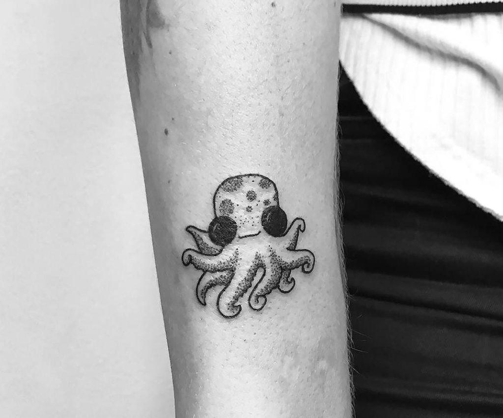 Photo of an octopus tattoo on the arm.