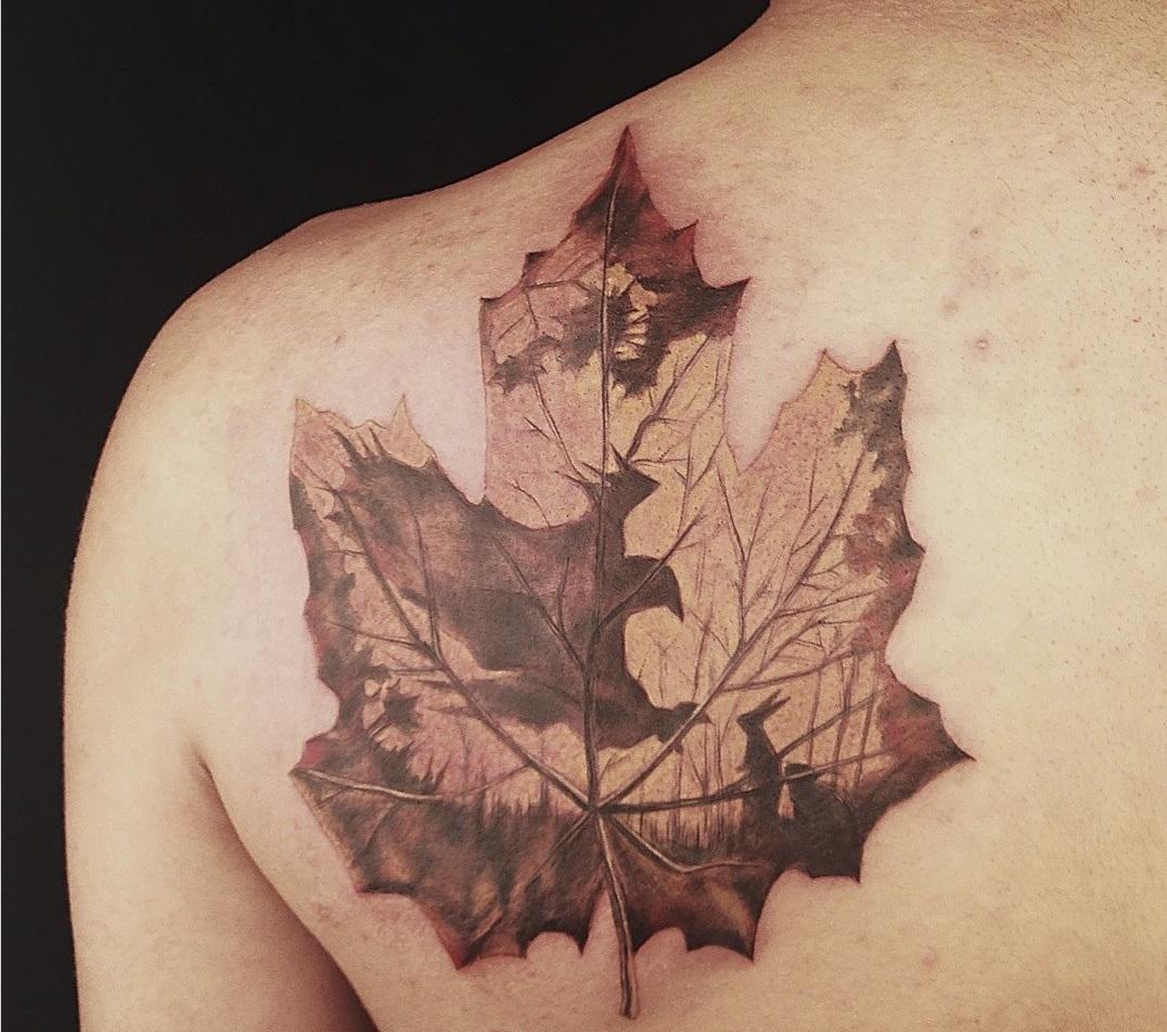 Photo of maple tattoo on body.