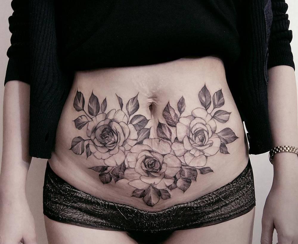 Photo of a tattoo to hide stretch marks on the stomach.