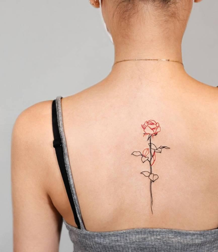 Photo of a tattoo along the spine for women.