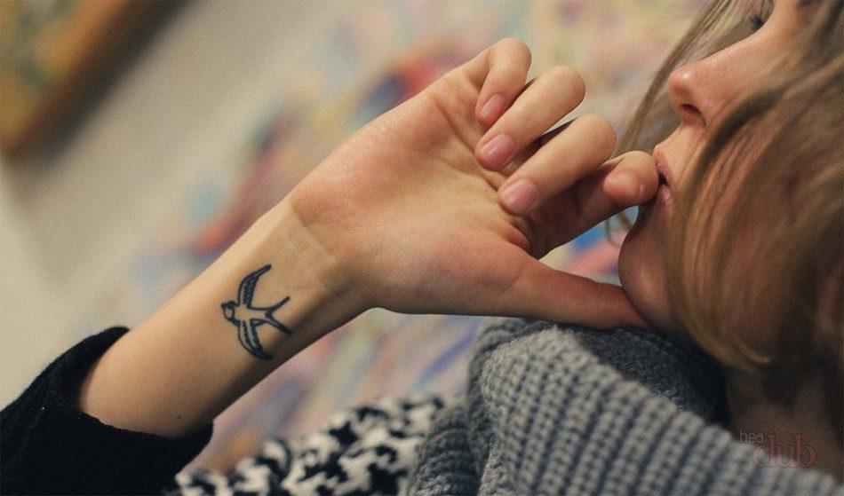 Oso tatuaje originalak besoan: ideiak eta esanahia
