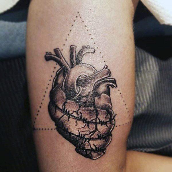 heart wrapped in barbed wire tattoo
