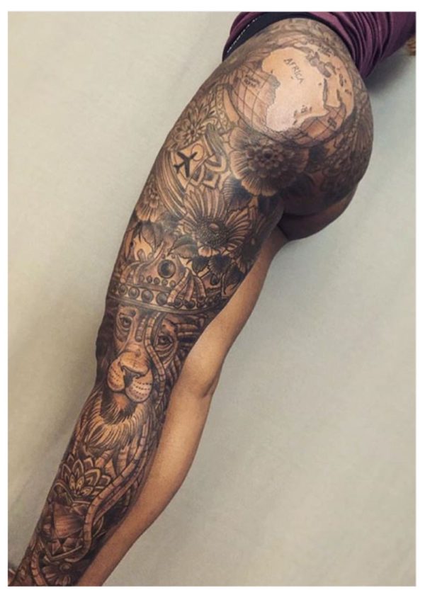 Tattoos on the legs with a large pattern.