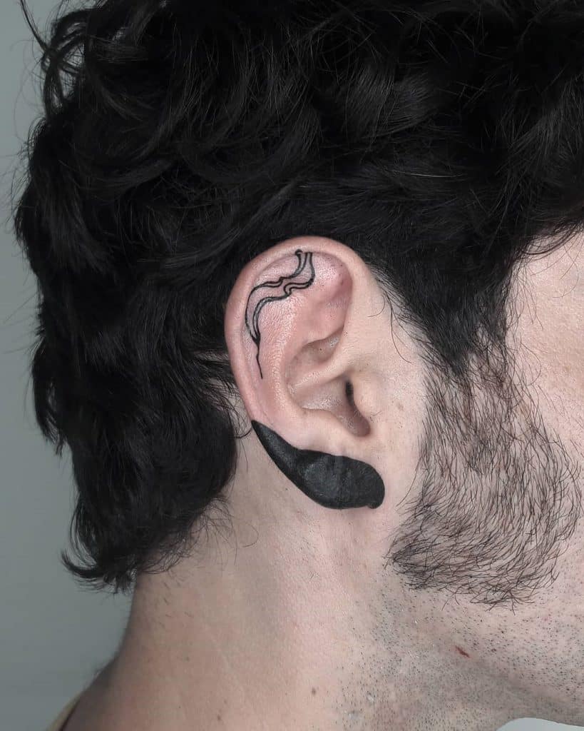 24 удивительных идеи дизайна татуировки за ухом (и что они означают)